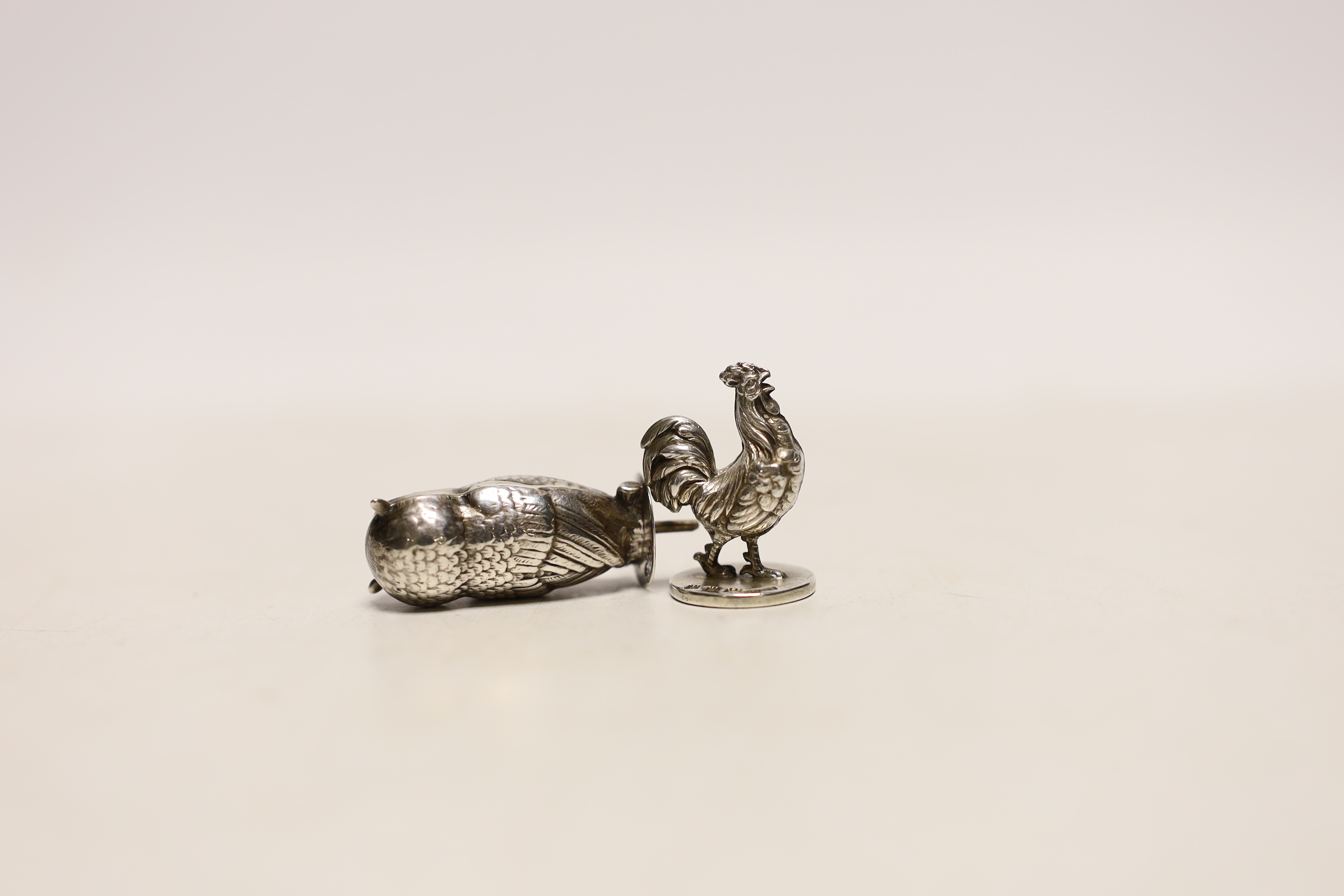 A George V silver miniature model of an owl, by Sampson Mordan & Co, Chester, 1910, 30mm and a silver cockerel seal, same maker, London, 1933.
